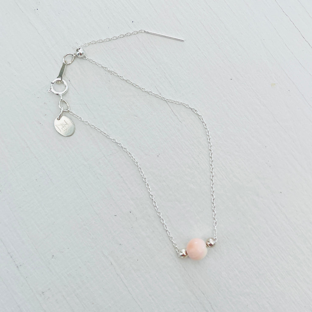 Adjustable chain Floating Conch Shell  Bracelet ZEN by Karen Moore on white background