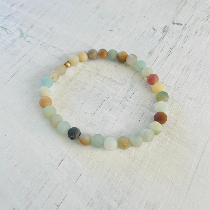 Be Kind Mini Gem Amazonite Bracelet by ZEN by Karen Moore overhead view on white wood