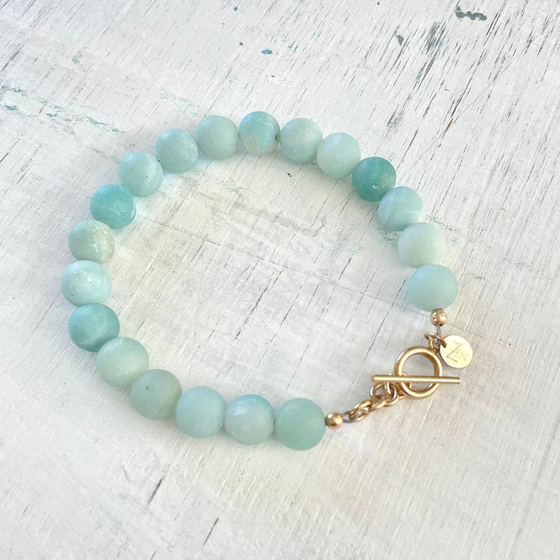 Be Brilliantly You Amazonite Bracelet by ZEN by Karen Moore slightly angled on white wood