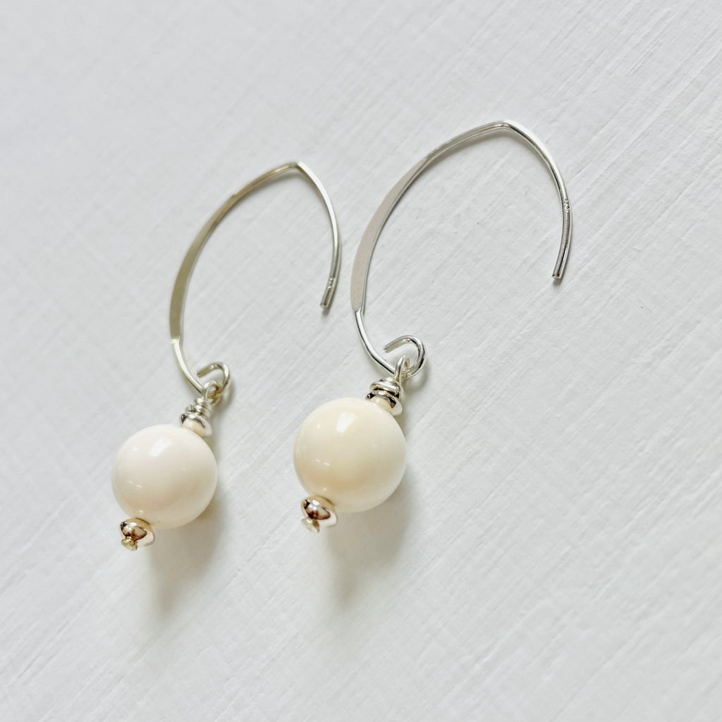 Classy Conch Shell Crescent Earrings by ZEN by Karen Moore in sterling silver on white background