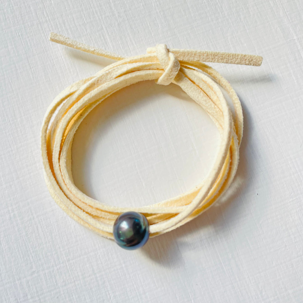 Pearl Of Wisdom Vanilla Vibes Eco Zen Wrap Jewelry by ZEN by Karen Moore angled view on white wood