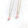 Delicate Inspiration conch shell necklace in sterling silver or 14k gold ball chain by ZEN by Karen Moore on white wood
