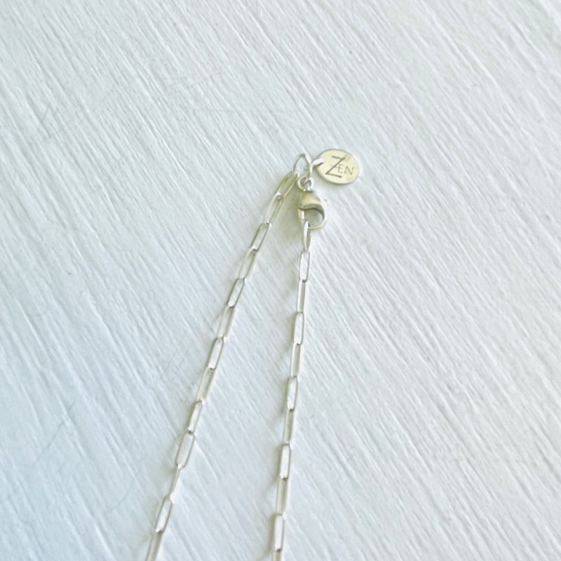 Clear Your Mind Aquamarine Necklace by ZEN by Karen Moore jewelry in sterling silver close up of clasp on white background