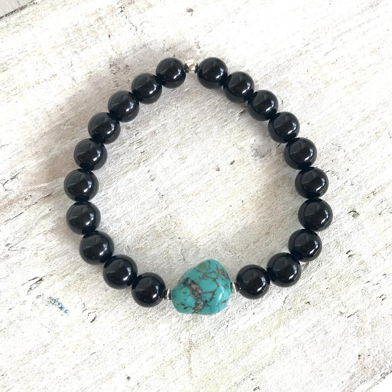 Rainbow obsidian & turquoise Rock Of Turquoise Bracelet by  ZEN by Karen Moore on white wood