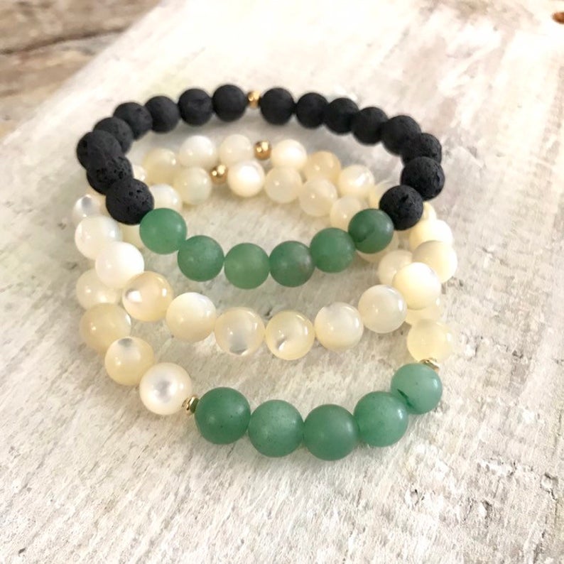 Live Well & Love aventurine & mother-of-pearl bracelet by ZEN by Karen Moore on white wood