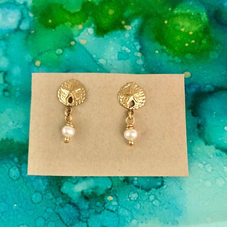 Pearl ZEN Mini Earrings by ZEN by Karen Moore set of three on blue/green splatter background