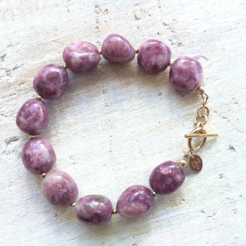 Let That Shit Go Lepidolite Bracelet with gold clasp by ZEN by Karen Moore overhead view on white wood