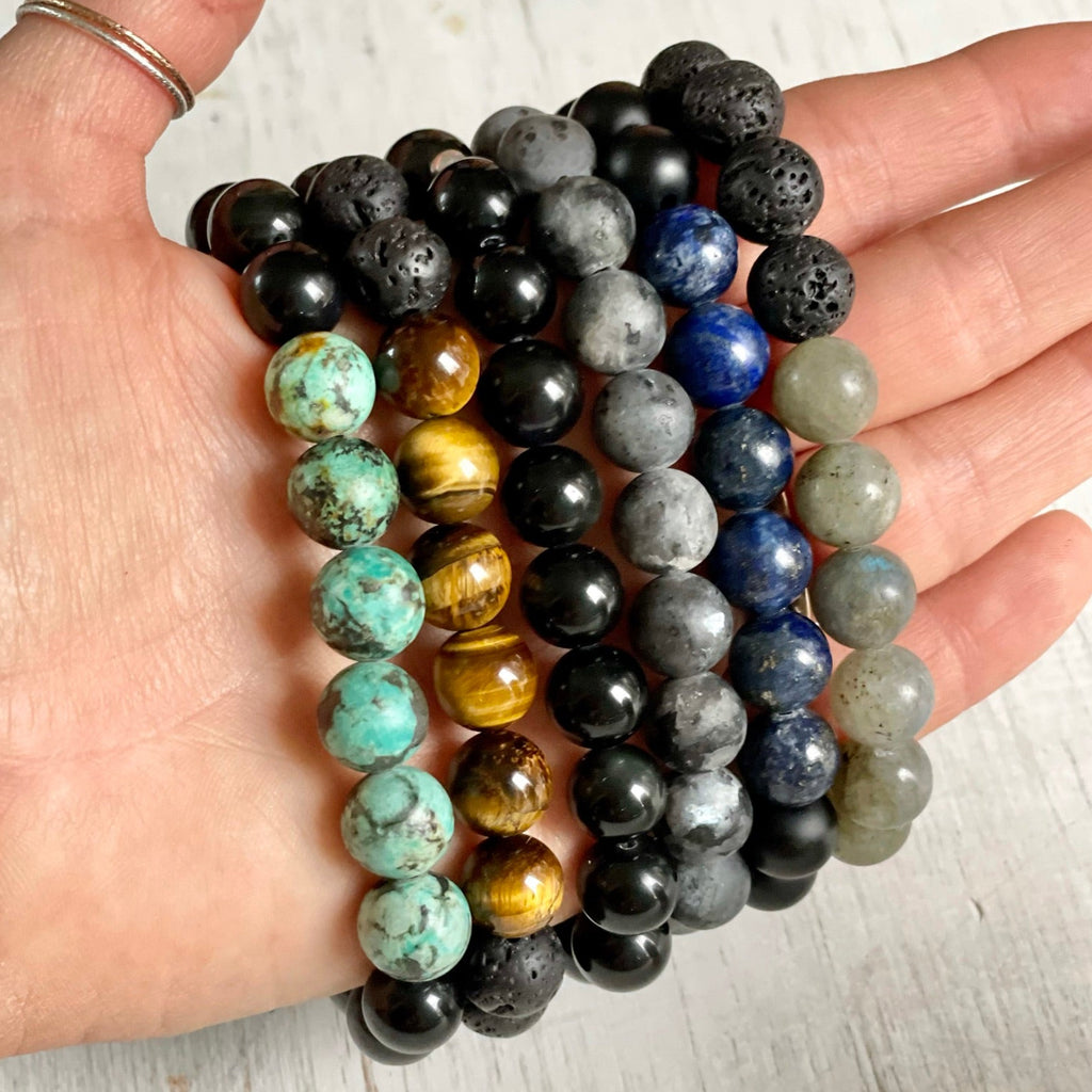 Grounded Health Turquoise & Obsidian Menz ZEN Bracelet by ZEN by Karen Moore on white wood background