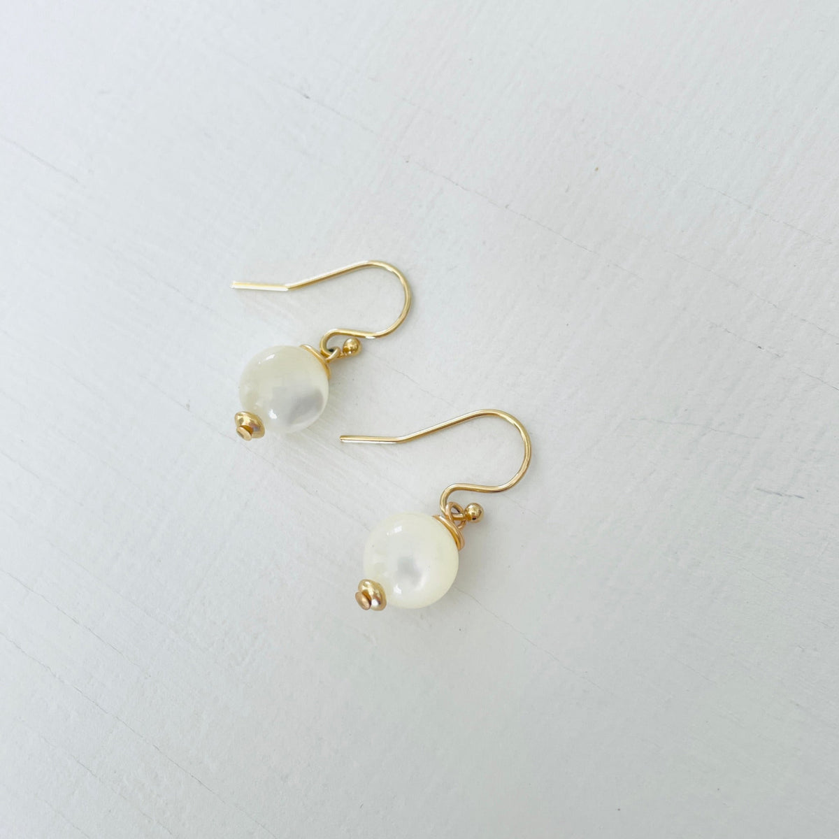 ZEN by Karen Moore Mother of Pearl Earring with 14kt gold-filled earring wires on white background