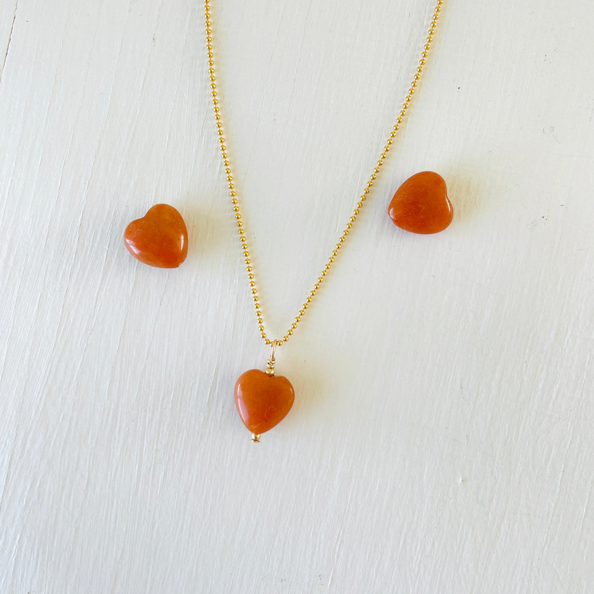 Aventurine gemstone charm necklace on 14kt gold filled ball chain on a white background