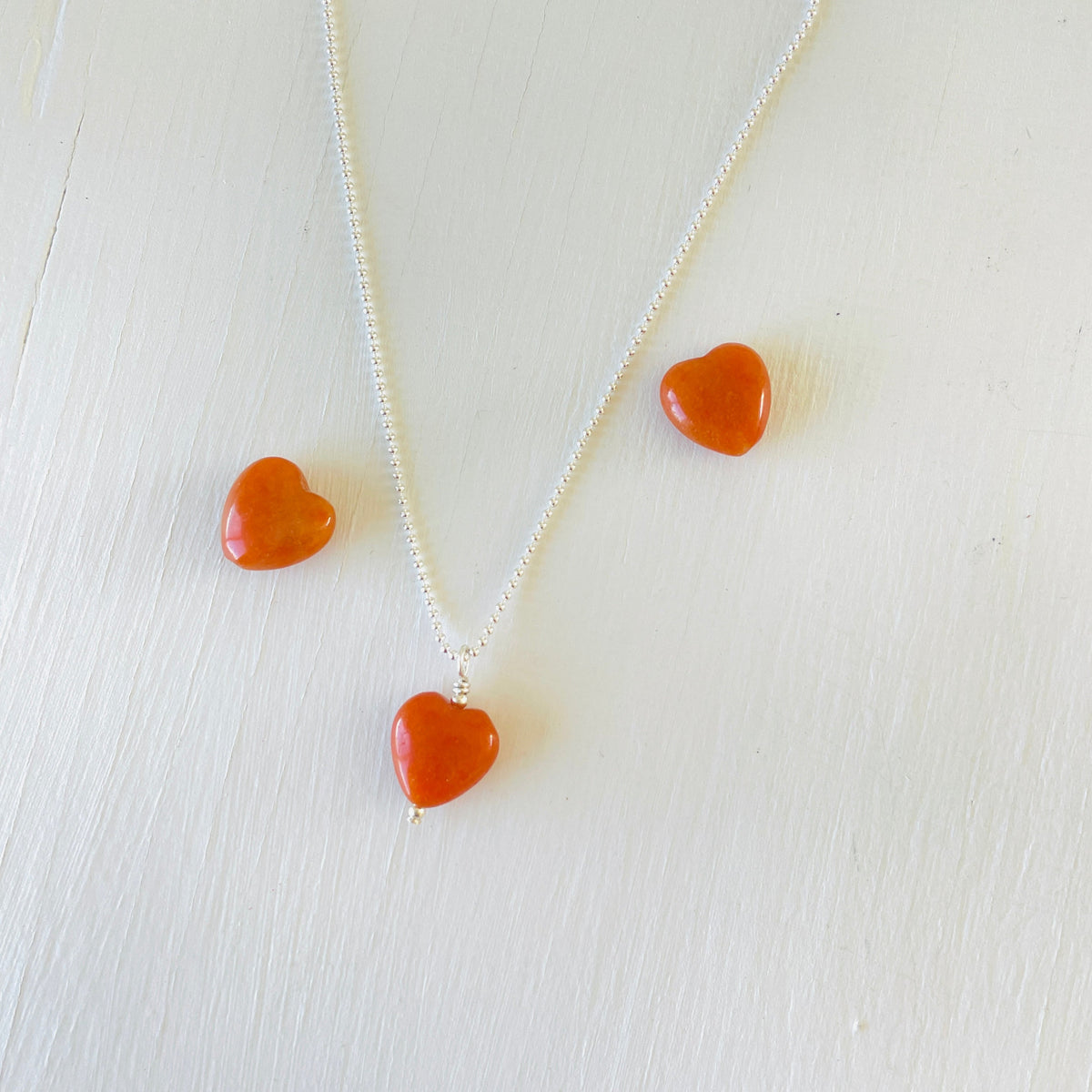 Aventurine gemstone charm necklace on sterling silver ball chain on a white background