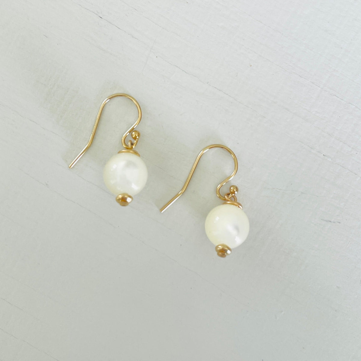 ZEN by Karen Moore Mother of Pearl Earring with 14kt gold-filled earring wires on white background