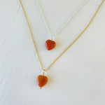 Orange Aventurine gemstone charm necklace on ball chain on a white background