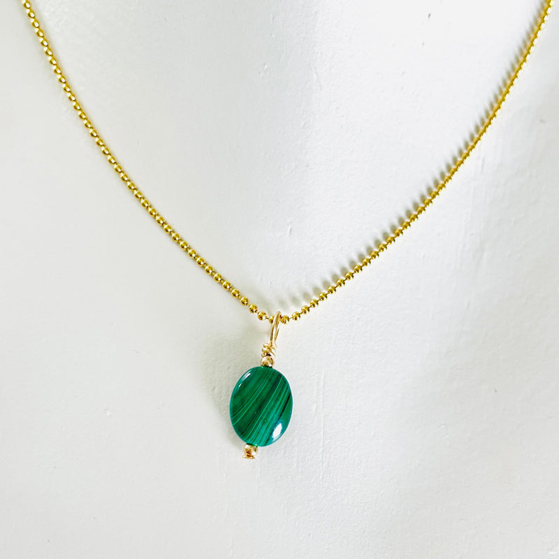 ZEN by Karen Moore green Malachite gemstone necklace on gold chain on white background