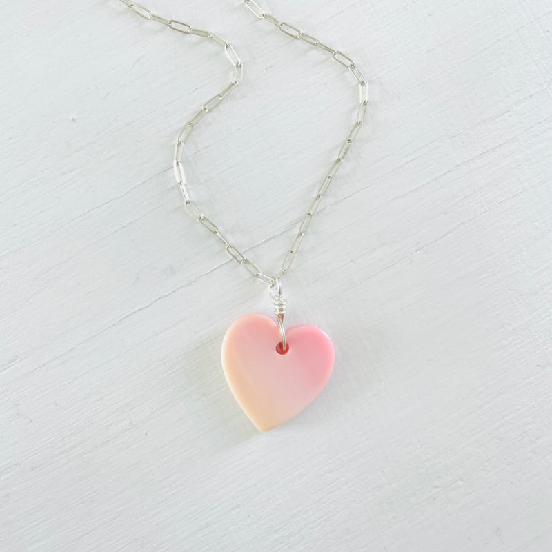 ZEN by Karen Moore heart shaped Conch Shell Necklace on a sterling silver on paperclip chain on a white backgroun