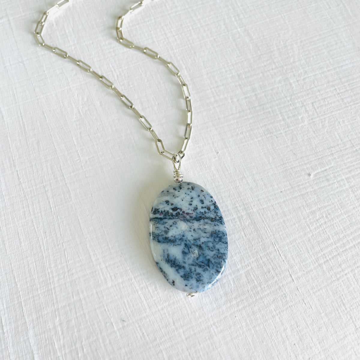Agate Pendant Denim Blue on a paperclip sterling chain on a white background and 