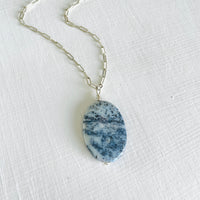 Agate Pendant Denim Blue on a paperclip sterling chain on a white background and 