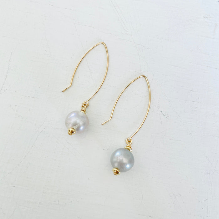 ZEN by Karen Moore Long Loop Gold Earrings with Grey Pearls on White Background