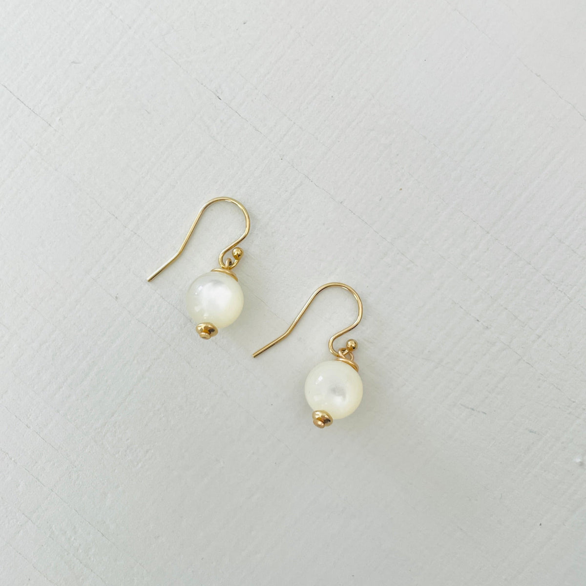 ZEN by Karen Moore Mother of Pearl Earring with 14kt gold-filled earring wires on white background