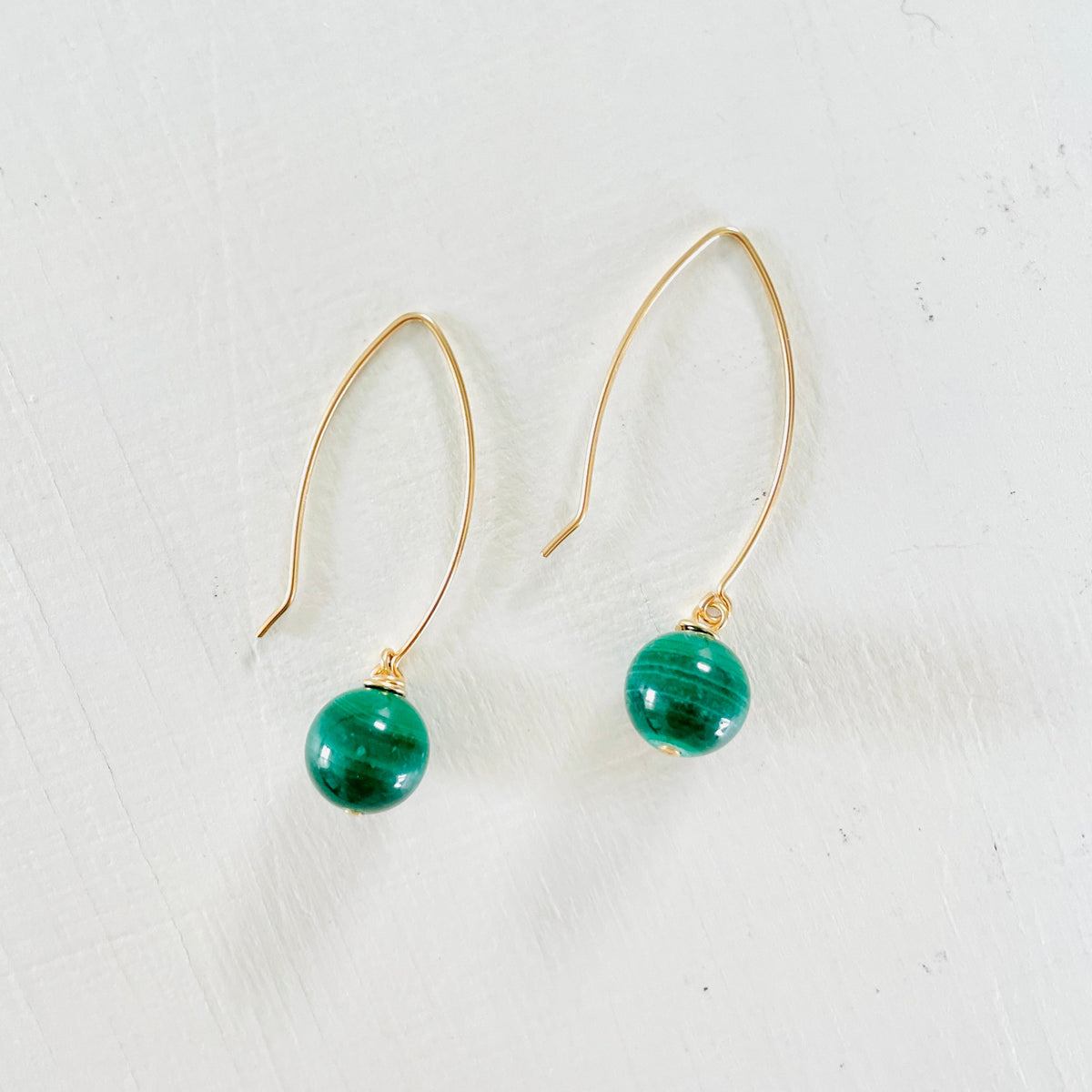 Malachite vibrant green earrings with gold on white background