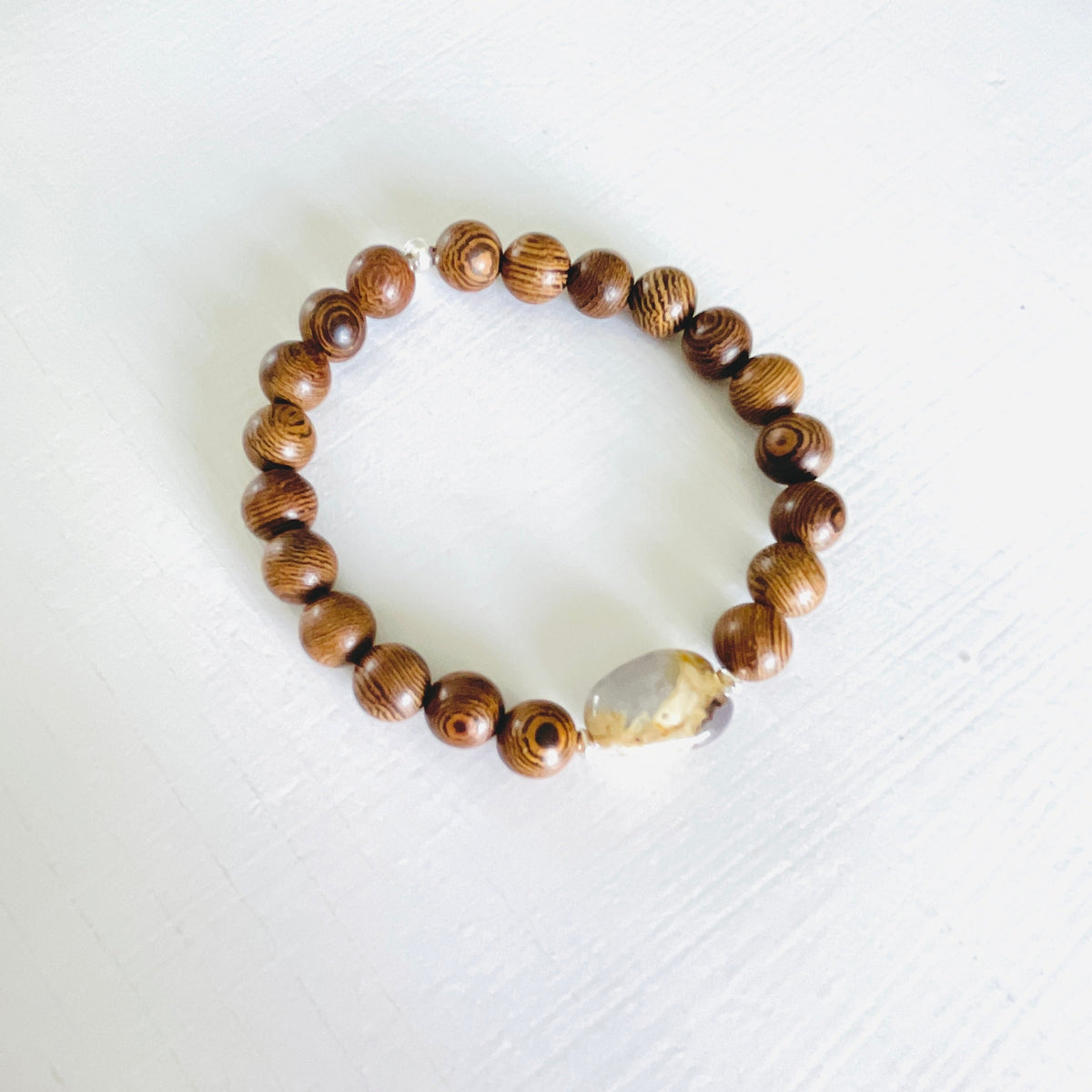 Mojo Amazonite Tiger Wood Bracelet by ZEN by Karen Moore on white wood background