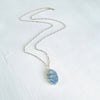 Agate Pendant Denim Blue on a paperclip sterling chain on a white background and 