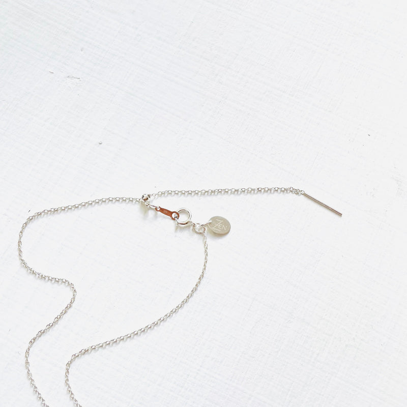 Floating Pearl Adjustable Necklace by ZEN by Karen Moore showing silver adjustable chain on white background