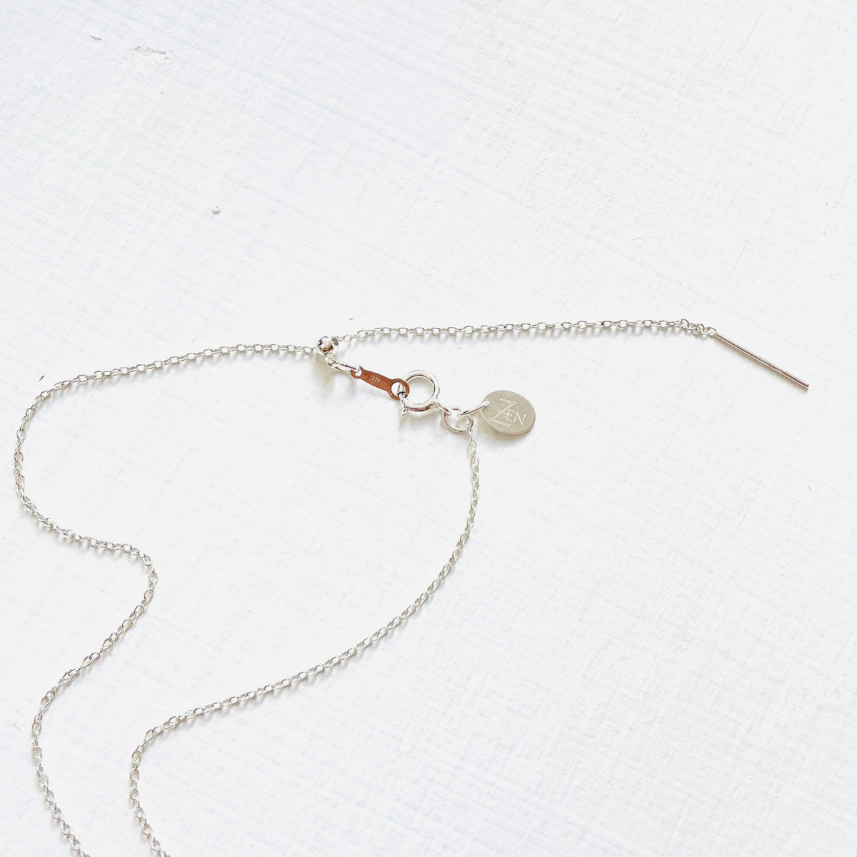 Floating Pearl Adjustable Necklace by ZEN by Karen Moore showing silver adjustable chain on white background