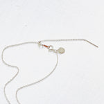 Floating Pearl Adjustable Necklace by ZEN by Karen Moore showing silver adjustable chain on white background