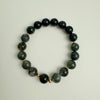 Green beaded bracelet on a white background