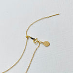 Floating Pearl Adjustable Necklace by ZEN by Karen Moore showing gold adjustable chain on white background