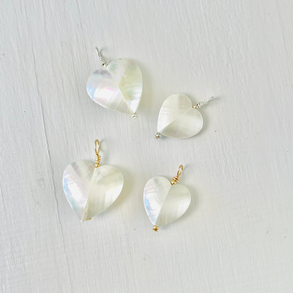 Puffy_Heart_Nautilus_Necklace Pendants on white background