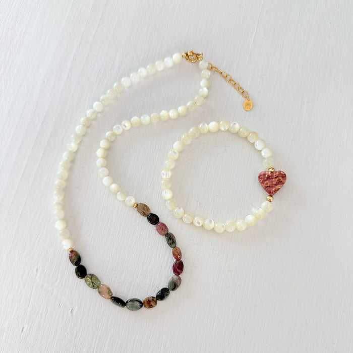 Watermelon Tourmaline Necklace with Mother of Pearl beads on a white background with a Mother of Pearl + Spiny Oyster Purple Heart Charm
