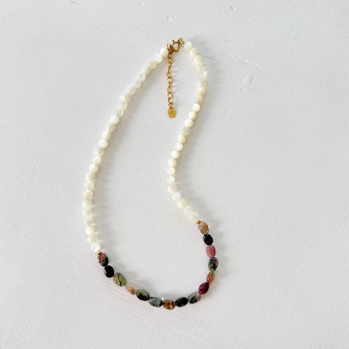 Watermelon Tourmaline Necklace with Mother of Pearl beads on a white background
