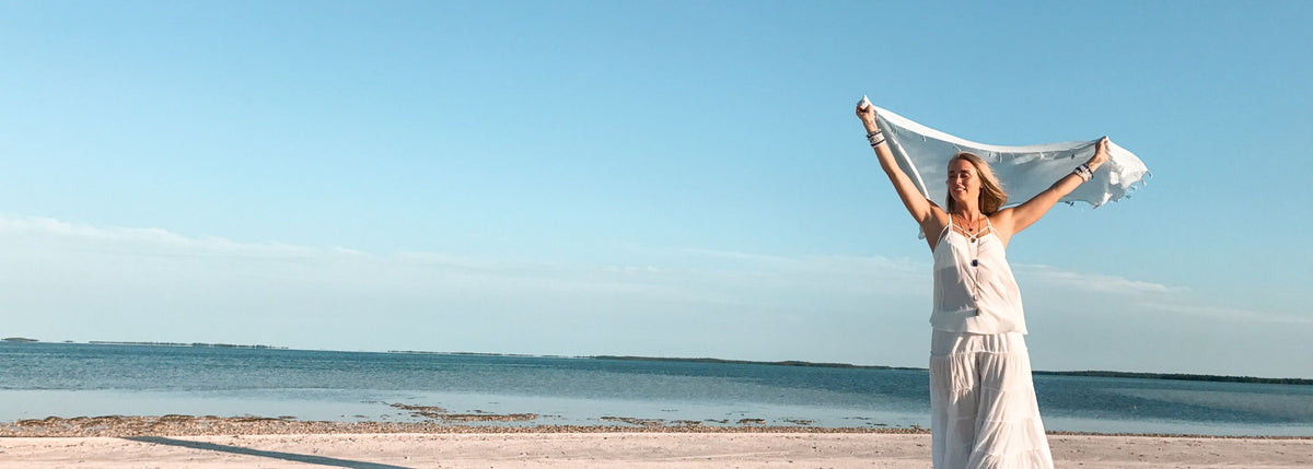 woman on the beach in ZEN jewelry