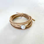 Pearl of Wisdom Shimmer Sand Eco ZEN Wrap® Jewelry by ZEN by Karen Moore on white wood