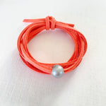 Pearl of Wisdom Coral VIbes Eco Zen Wrap Jewelry by ZEN by Karen Moore on white wood