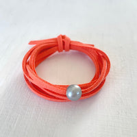 Pearl of Wisdom Coral VIbes Eco Zen Wrap Jewelry by ZEN by Karen Moore on white wood