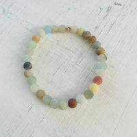 Be Kind Mini Gem Amazonite Bracelet by ZEN by Karen Moore overhead view on white wood