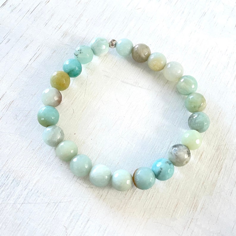 Feel Balance Within Amazonite Bracelet by ZEN by Karen Moore overhead view on white wood