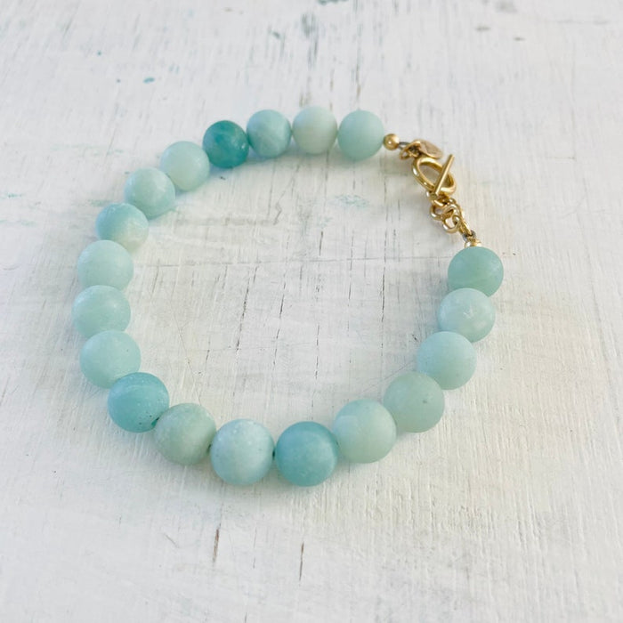Be Brilliantly You Amazonite Bracelet by ZEN by Karen Moore slightly angled on white wood