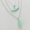 Trio of blue and turquoise sterling silver pendant necklaces by ZEN by Karen Moore on white background