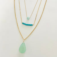 complimentary Layered Blue Gemstone Necklace trio by ZEN by Karen Moore on white background close up