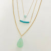 complimentary Layered Blue Gemstone Necklace trio by ZEN by Karen Moore on white background close up