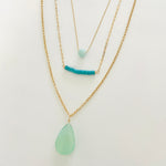 Turquoise & Gold Necklace trio by ZEN by Karen Moore close up on white background