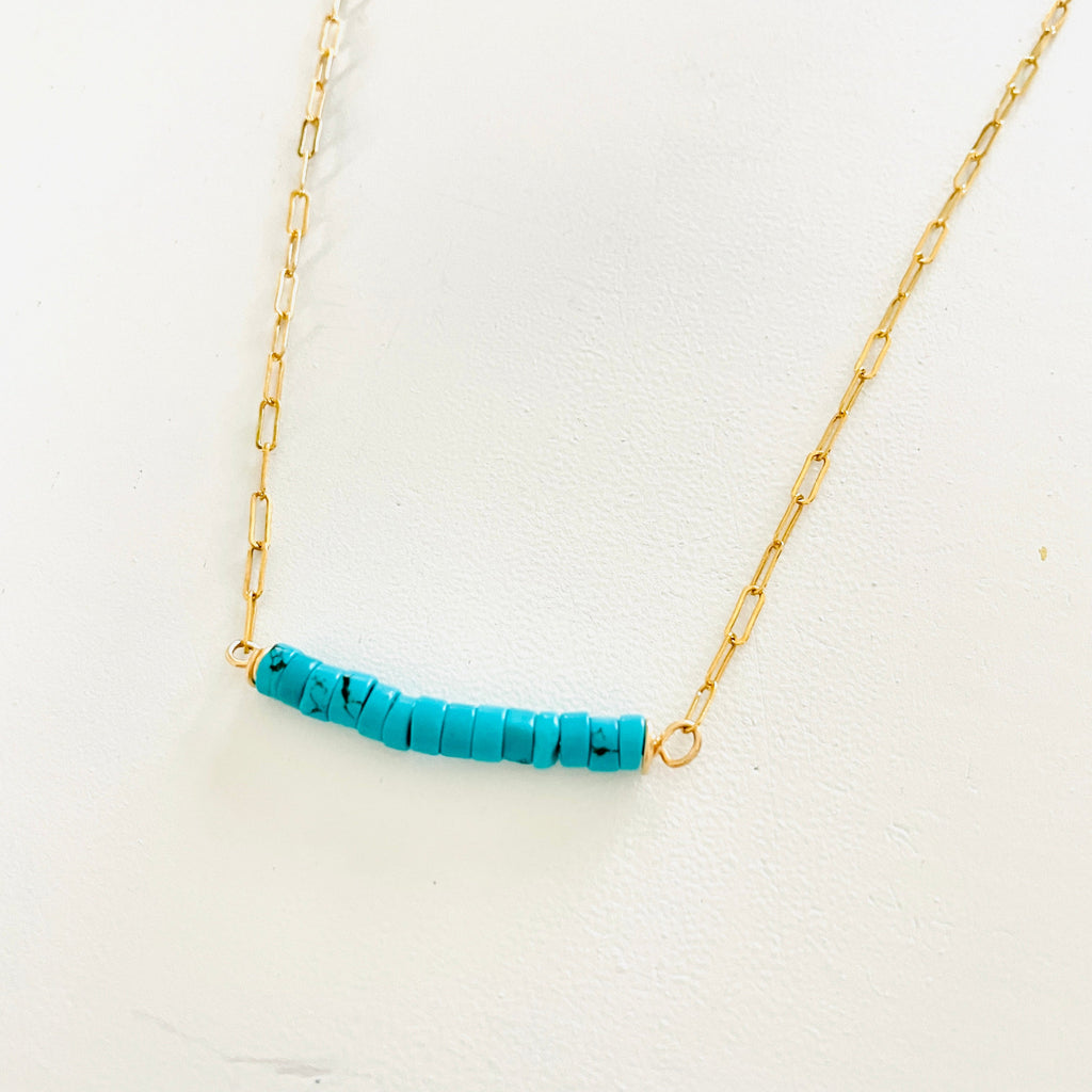 Turquoise at The Bar Gold Necklace by ZEN by Karen Moore close up overhead view on white background