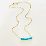Turquoise at the Bar Gold Necklace by ZEN by Karen Moore on white background