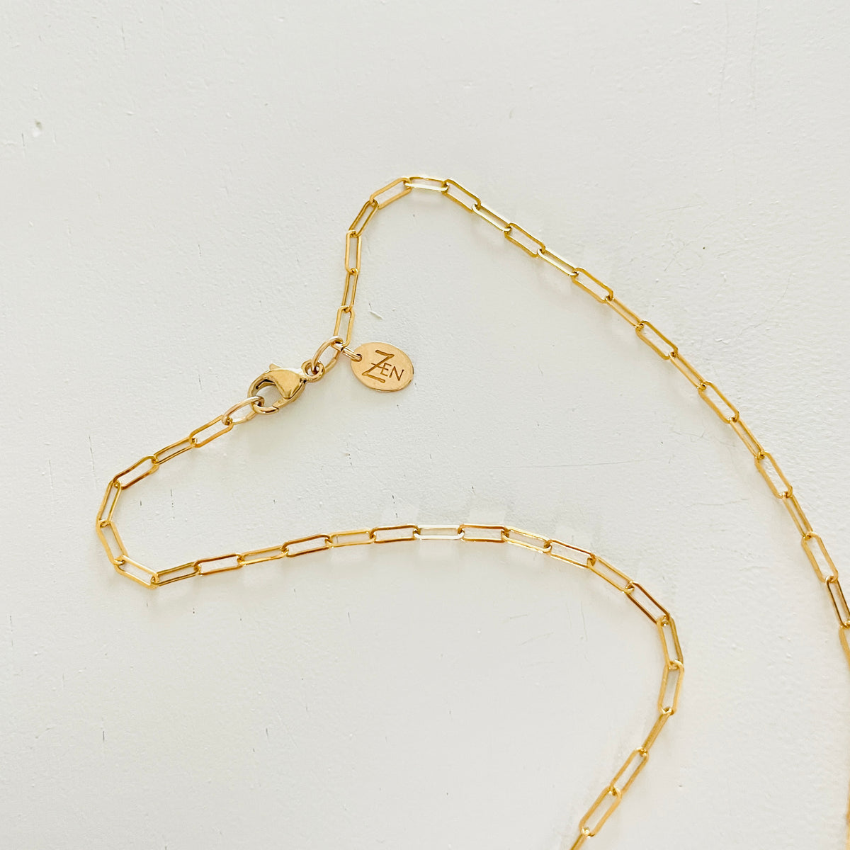 Turquoise at the Bar Gold Necklace by ZEN by Karen Moore showig the gold chain on white background