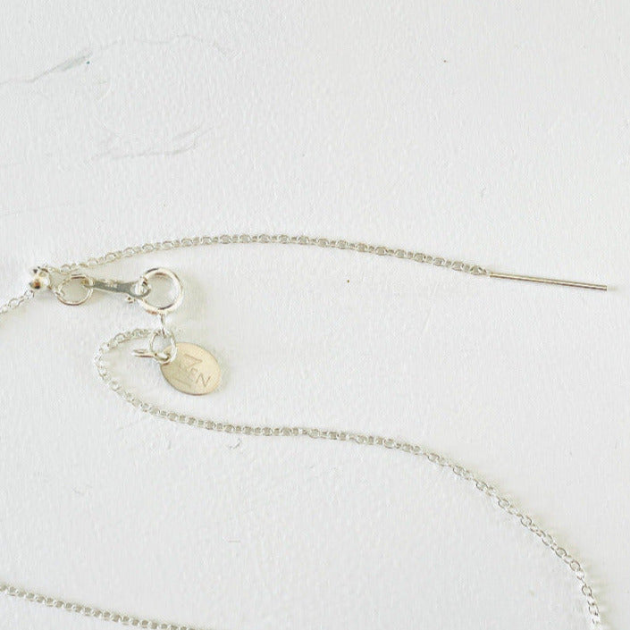 Adjustable chain and clasp on Floating chain by ZEN by Karen Moore on white background