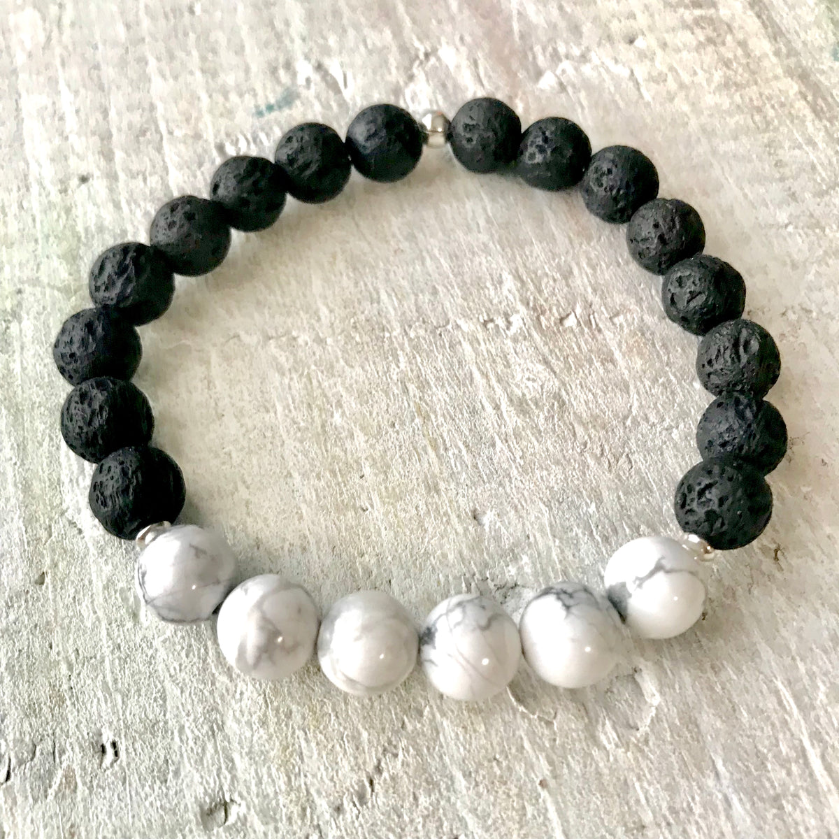 Howlite & lava stone Be Bliss Aromatherapy Bracelet by ZEN by Karen Moore on white wood